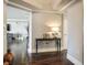 Hallway with dark floors, neutral walls, and dark wood console table with lamp at 2777 Paradise Rd # 1701, Las Vegas, NV 89109
