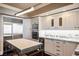 Well-appointed kitchen features stainless steel refrigerator, granite counters and center island at 2777 Paradise Rd # 1701, Las Vegas, NV 89109