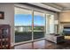 Elegant living room with dark wood floors, a balcony with mountain views, and a decorative fireplace at 2777 Paradise Rd # 1701, Las Vegas, NV 89109