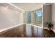 Bright living room featuring hardwood floors, large windows with natural light, and balcony access in a neutral color palette at 2777 Paradise Rd # 1701, Las Vegas, NV 89109
