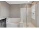 Bathroom featuring bathtub and glass enclosed shower at 2853 Cabrillo Terrace St, Henderson, NV 89044
