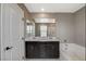 Bathroom featuring double sink vanity, bathtub and shower at 2853 Cabrillo Terrace St, Henderson, NV 89044