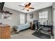This bedroom has a ceiling fan, carpet, and a desk at 2853 Cabrillo Terrace St, Henderson, NV 89044