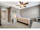 This bedroom includes carpet, a ceiling fan and a neutral color palette at 2853 Cabrillo Terrace St, Henderson, NV 89044