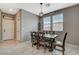 Inviting dining area features a wooden table, pendant lighting, and natural light from a nearby window at 2853 Cabrillo Terrace St, Henderson, NV 89044