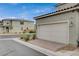 Attached garage featuring a driveway paved with decorative brick at 2853 Cabrillo Terrace St, Henderson, NV 89044