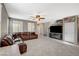 Inviting living area with a leather sectional, tile flooring, and entertainment center at 2853 Cabrillo Terrace St, Henderson, NV 89044