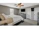 Well-lit main bedroom with soft carpet, ceiling fan, and dark wood furniture at 2853 Cabrillo Terrace St, Henderson, NV 89044