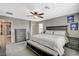 Spacious main bedroom with soft carpet, ceiling fan, and dark wood furniture at 2853 Cabrillo Terrace St, Henderson, NV 89044