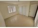 Bedroom with tile floors, a window with blinds, and a closet at 2859 Wheelwright Dr, Las Vegas, NV 89121