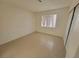Bedroom showcasing tile floors, neutral paint, closet, and natural light at 2859 Wheelwright Dr, Las Vegas, NV 89121
