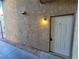 Building entrance featuring stucco walls, concrete sidewalk, and dark door at 2859 Wheelwright Dr, Las Vegas, NV 89121