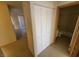 Hallway featuring a closet with views into the bathroom and living area at 2859 Wheelwright Dr, Las Vegas, NV 89121