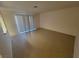 Spacious living room features neutral paint, a large sliding glass door, and tile floors at 2859 Wheelwright Dr, Las Vegas, NV 89121