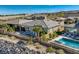 A beautiful home with a pool, mountain views, and desert landscaping at 2910 Raywood Ash Dr, Las Vegas, NV 89138