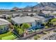 A beautiful home with a pool, playground, mountain views, and desert landscaping at 2910 Raywood Ash Dr, Las Vegas, NV 89138