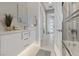 Well-lit bathroom with modern vanity, walk-in shower, and tile floors at 2910 Raywood Ash Dr, Las Vegas, NV 89138