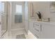 Bright bathroom with white cabinets, neutral tiles, and a luxurious feel at 2910 Raywood Ash Dr, Las Vegas, NV 89138