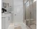 Bathroom showing a glass shower, white cabinets and countertops, a door, and a mirror at 2910 Raywood Ash Dr, Las Vegas, NV 89138