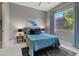 Bright bedroom features neutral colors, large windows, and a ceiling fan at 2910 Raywood Ash Dr, Las Vegas, NV 89138