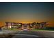 Stunning clubhouse with modern architecture, stone accents, and manicured lawn at 2910 Raywood Ash Dr, Las Vegas, NV 89138