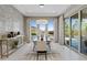 Elegant dining room with stone accent wall and sliding glass doors to outdoor patio at 2910 Raywood Ash Dr, Las Vegas, NV 89138