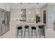 Stylish modern kitchen with stainless steel appliances, island seating, and bright white cabinetry at 2910 Raywood Ash Dr, Las Vegas, NV 89138