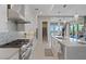 Modern kitchen featuring stainless steel appliances, a gas range, and elegant white cabinetry at 2910 Raywood Ash Dr, Las Vegas, NV 89138