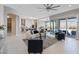 Open-concept living room featuring backyard views, modern furnishings and seamless indoor-outdoor living at 2910 Raywood Ash Dr, Las Vegas, NV 89138