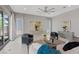 Comfortable living area featuring contemporary decor, tile flooring and lots of natural light at 2910 Raywood Ash Dr, Las Vegas, NV 89138