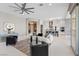 Bright living space with modern decor, open layout to kitchen, and backyard patio access at 2910 Raywood Ash Dr, Las Vegas, NV 89138