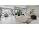 Spacious living room with modern furnishings and sliding doors to the outdoor patio and pool at 2910 Raywood Ash Dr, Las Vegas, NV 89138