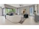 Spacious living room with modern decor and large sliding doors for outdoor access to the backyard at 2910 Raywood Ash Dr, Las Vegas, NV 89138