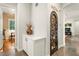 Hallway features decorative door, white built-in cabinet and tile flooring at 2964 Via Della Amore, Henderson, NV 89052