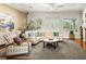 Spacious living room featuring comfortable seating, abundant natural light, and a welcoming ambiance at 2964 Via Della Amore, Henderson, NV 89052