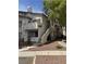 Inviting condo featuring a quaint balcony, a private entrance, and lush landscaping at 3059 Key Largo Dr # 203, Las Vegas, NV 89120
