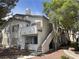 Charming condo with private balcony, inviting front entrance, and beautiful landscaped yard at 3059 Key Largo Dr # 203, Las Vegas, NV 89120