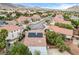 Scenic aerial view of a neighborhood with homes featuring solar panels and lush landscaping at 3200 Ridgecliff St, Las Vegas, NV 89129