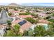 Stunning aerial view of a home with solar panels, nestled in a picturesque neighborhood at 3200 Ridgecliff St, Las Vegas, NV 89129