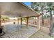 Covered patio with ceiling fans overlooking low maintenance backyard landscaping at 3200 Ridgecliff St, Las Vegas, NV 89129