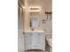 Bathroom boasts white vanity with storage, modern lighting, and contrasting hardware with a neutral color palette at 3200 Ridgecliff St, Las Vegas, NV 89129
