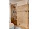 Bathroom features tiled walk-in shower with glass partition and a stone border, as well as neutral coloring at 3200 Ridgecliff St, Las Vegas, NV 89129