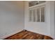Well-lit room featuring hardwood floors, white walls and trim, and a window with white shutters at 3200 Ridgecliff St, Las Vegas, NV 89129