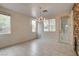 Well-lit dining area with modern light fixture and access to outdoor patio at 3200 Ridgecliff St, Las Vegas, NV 89129