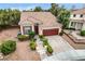Charming home with a well-maintained lawn, a two-car garage, and decorative landscaping at 3200 Ridgecliff St, Las Vegas, NV 89129