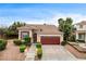 Charming single-Gathering home with a well-manicured front yard and a two-car garage at 3200 Ridgecliff St, Las Vegas, NV 89129