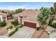 Inviting home with a tile roof, mature trees, desert landscaping, and a two-car garage at 3200 Ridgecliff St, Las Vegas, NV 89129