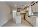Modern kitchen with stainless appliances, island, and tile backsplash at 3200 Ridgecliff St, Las Vegas, NV 89129