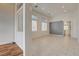 Bright, open-concept living room with tile floors, white walls, recessed lighting, and architectural accent wall at 3200 Ridgecliff St, Las Vegas, NV 89129