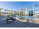 Relaxing rooftop pool area with lounge chairs and clear city views at 3722 Las Vegas Blvd # 2509, Las Vegas, NV 89158